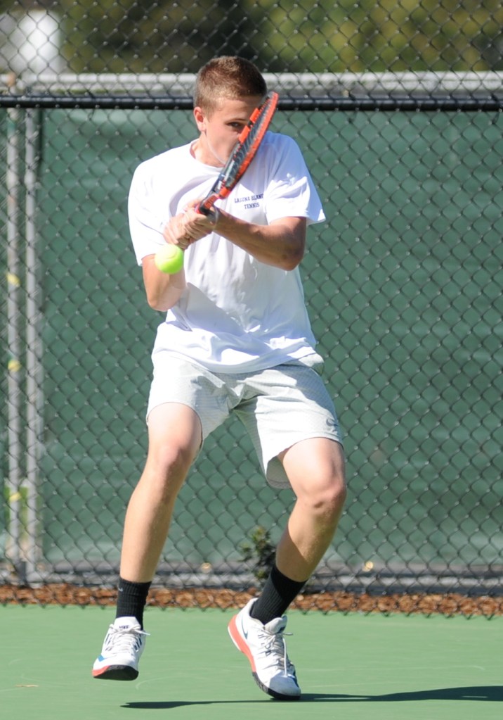 Tristan Prinz fends off a tough backhand during play against Rio Mesa's #1 Anthony Baltazar