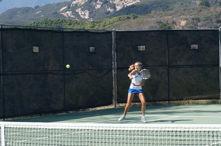 Victoria Herman smacks a down-the-line winner