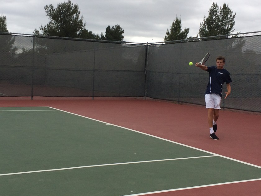 Henry Farrell swats a backhand for Laguna Blanca Tennis