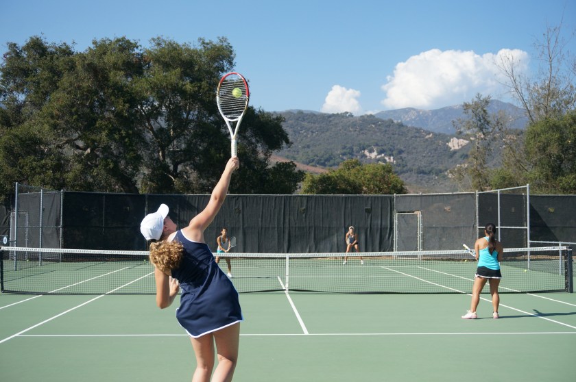 Madeleine Nelson gets the center of the strings on serve